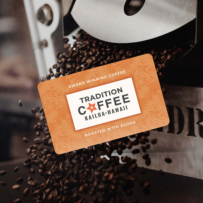 Tradition Coffee Roasters digital gift card displaying the brand logo against an orange tropical leaf pattern, with roasted coffee beans falling in the background